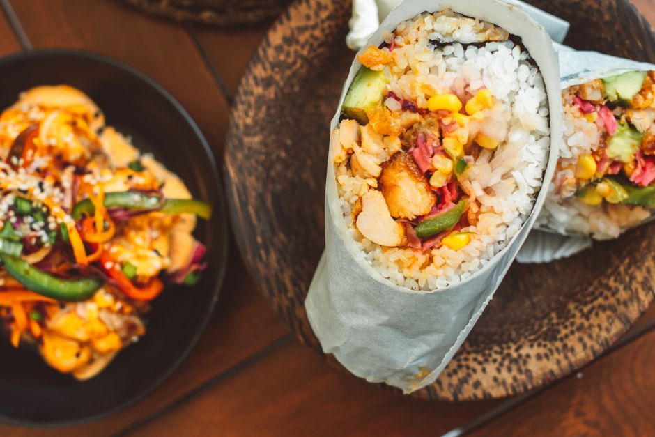 Burritos — A large flour tortilla wrapped around rice, beans and filling.