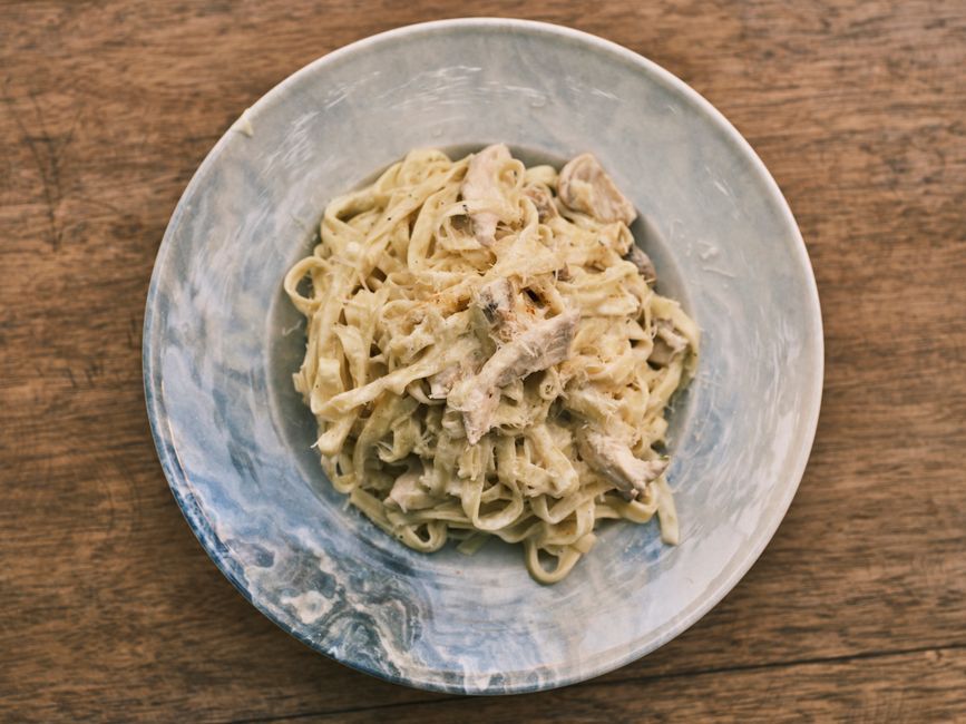 Fettuccine Alfredo — Flat ribbon pasta in a butter and parmesan cream sauce.