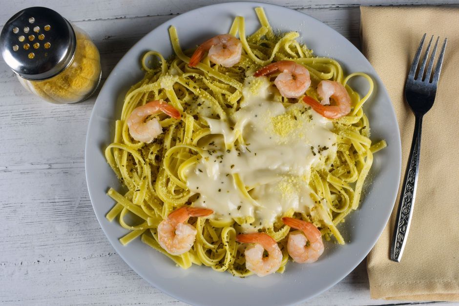Fettuccine Alfredo — Flat ribbon pasta in a butter and parmesan cream sauce.