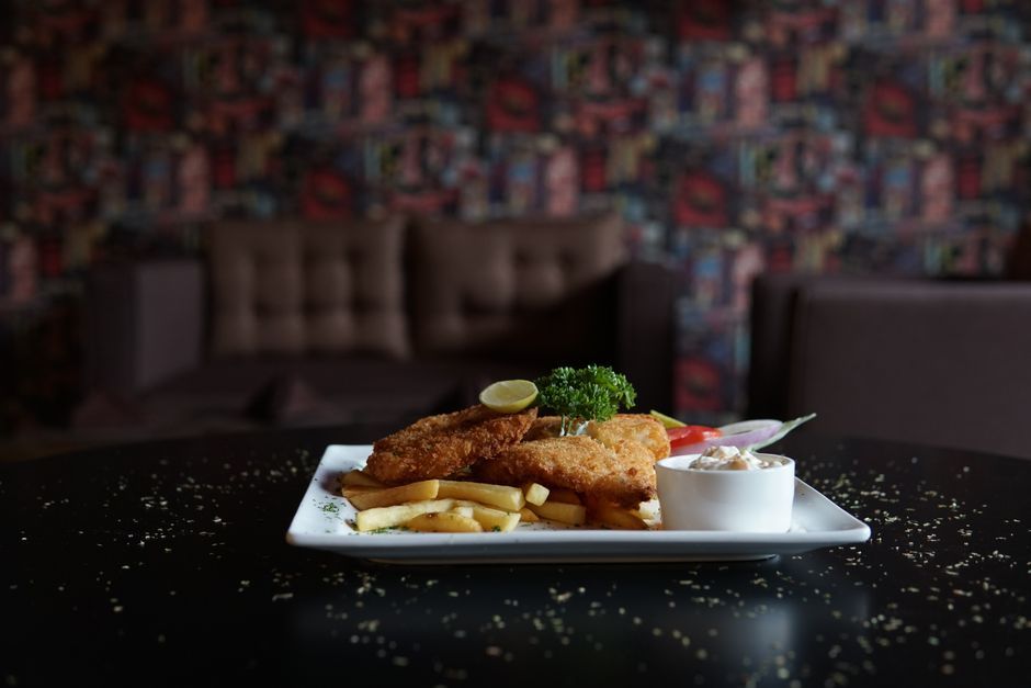 Hand-Battered Fried Fish — White fish in a seasoned coating, fried crisp.