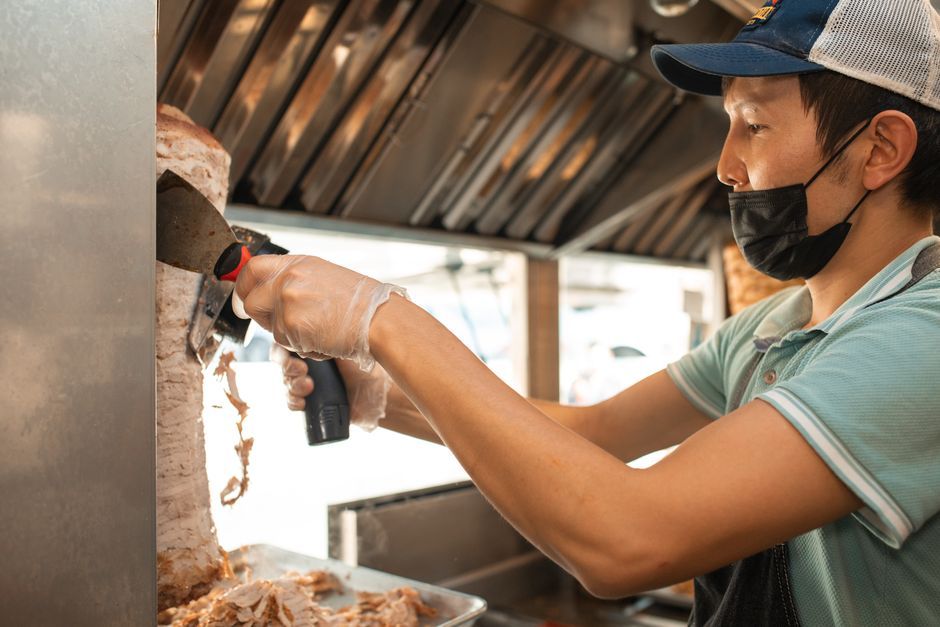 Chicken Gyro — Spit-roasted meat in pita with tomato and yoghurt sauce.