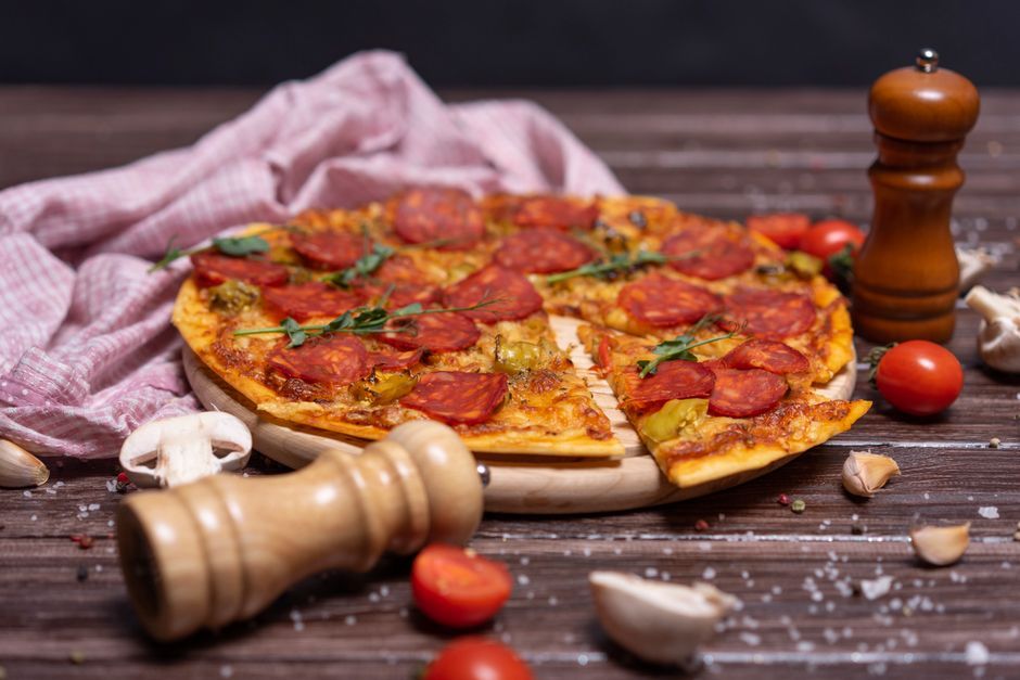 Pepperoni Pizza — Mozzarella and cured pepperoni, baked until the edges curl.