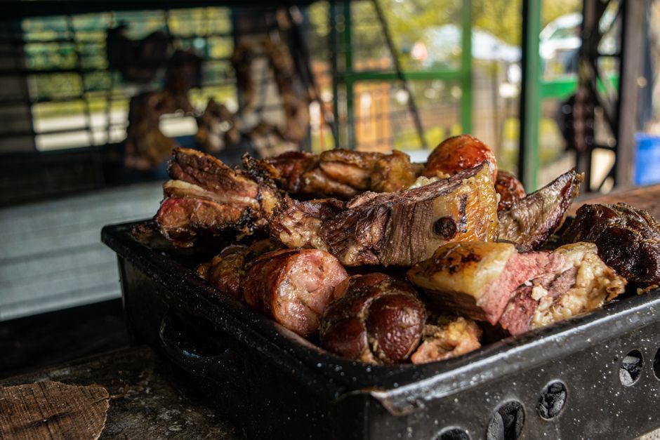 Pernil — Slow-roasted pork shoulder with crisp skin.