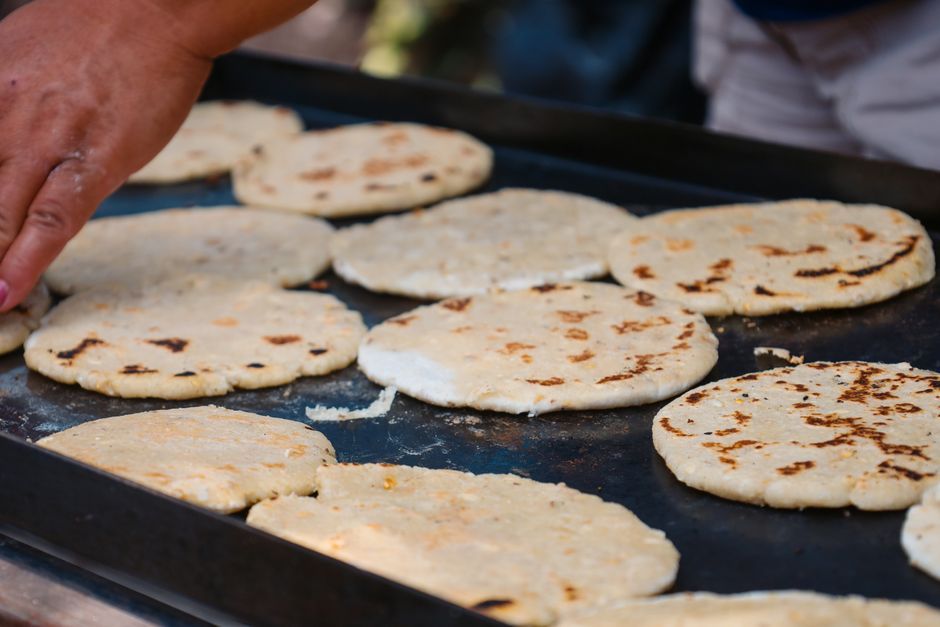 Pupusas — Thick griddled corn cakes stuffed with cheese, beans or pork.