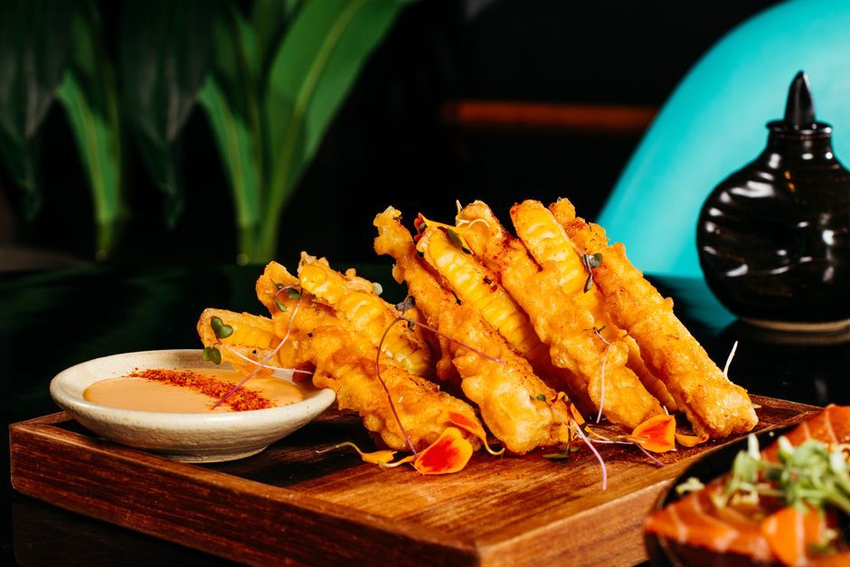 Tempura — Seafood or vegetables in a light batter, fried.