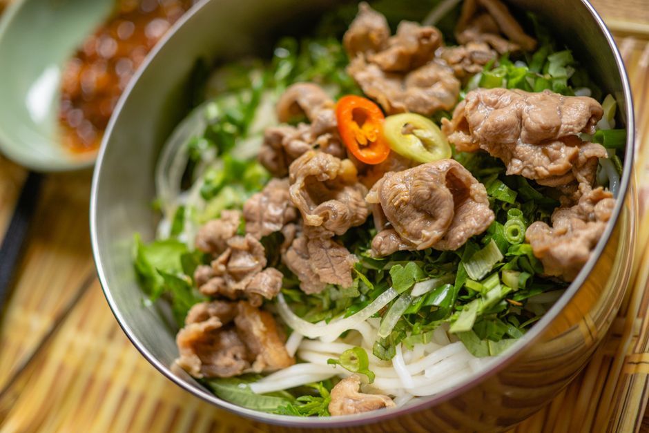Bowls — Cold rice noodles topped with grilled meat and herbs.