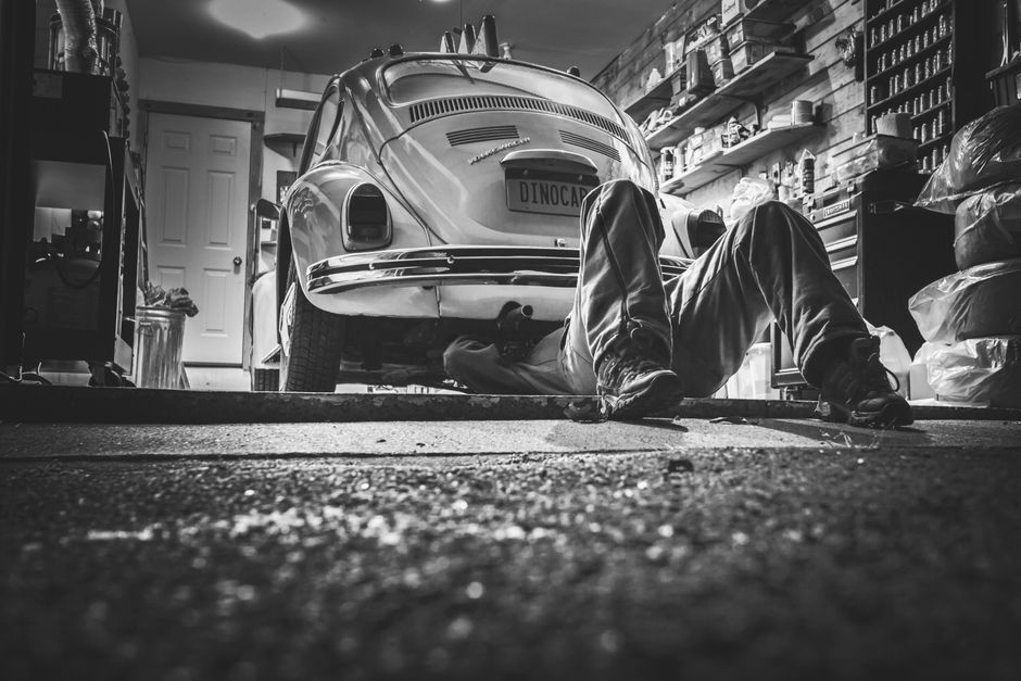 A vehicle being serviced in a repair garage