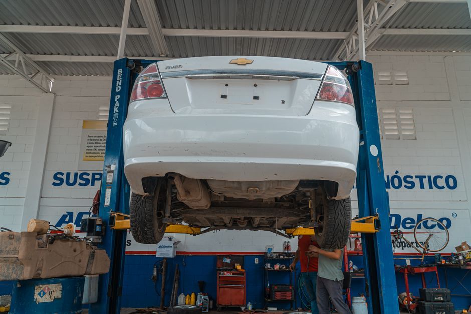 A vehicle being serviced in a repair garage