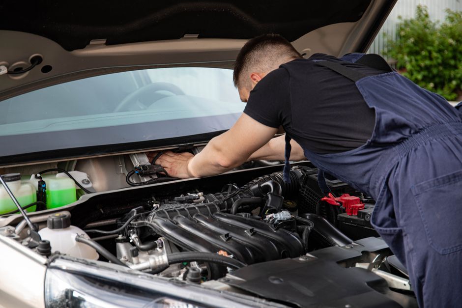 A vehicle being serviced in a repair garage