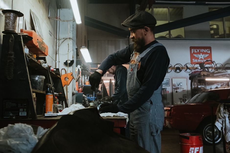 A vehicle being serviced in a repair garage