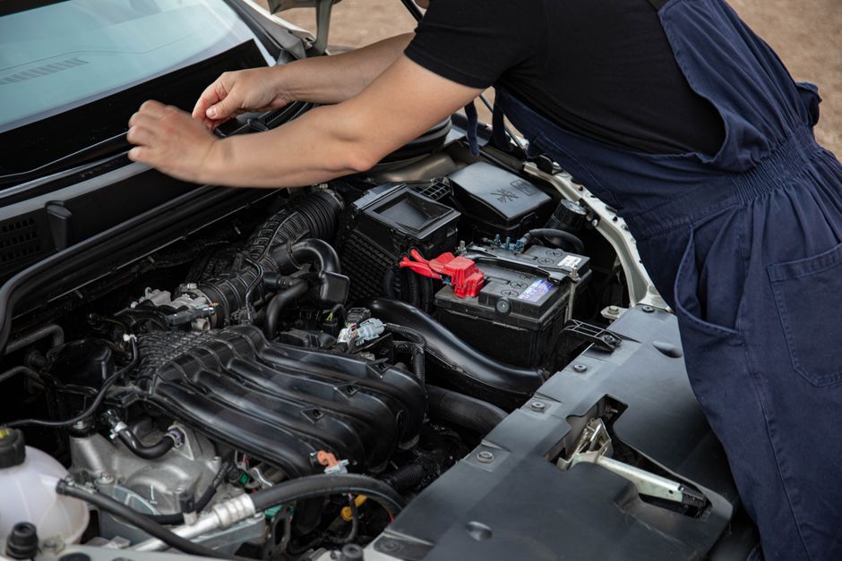 A vehicle being serviced in a repair garage