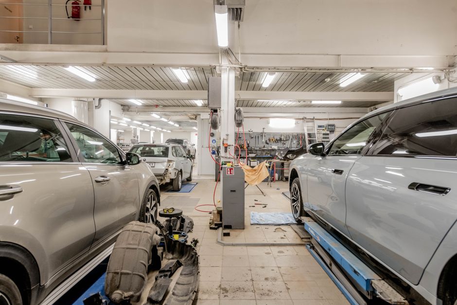 A vehicle being serviced in a repair garage
