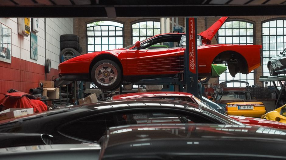 A vehicle being serviced in a repair garage