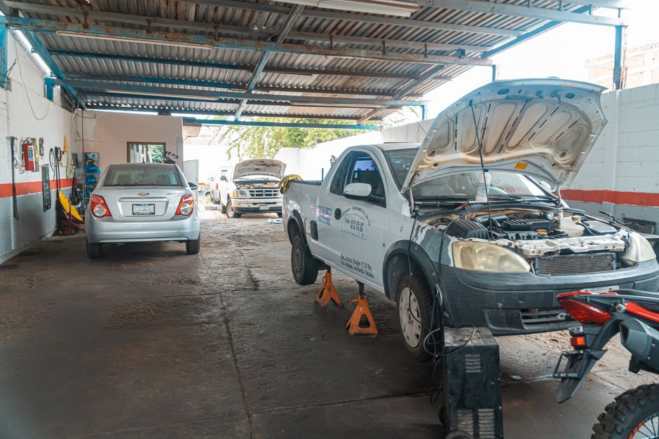 A vehicle being serviced in a repair garage